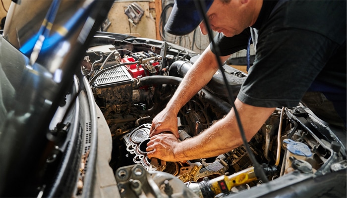 Autocare Pro's technician repairing an engine in Lake Jackson TX